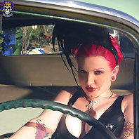 busty redhead slips off rubber in vintage car