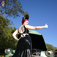 busty redhead slips off rubber in vintage car