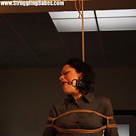 Steffi dangling on rope tightly ballgagged drooling