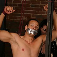 Horny domina chains and tortures a sudmissive stud