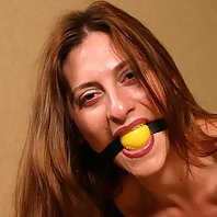 Auburn haired babe Angel Corte getting gagged and tied up on a chair