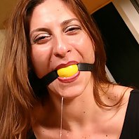 Auburn haired babe Angel Corte getting gagged and tied up on a chair