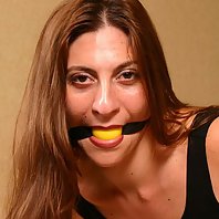 Auburn haired babe Angel Corte getting gagged and tied up on a chair