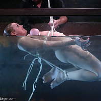 Busty blonde beauty is bound, gagged and tormented with water.