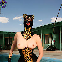 Pervy rubber fetish cat girl gets wet