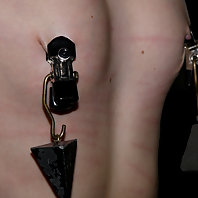 Hailey Young and Ariel locked in severe steel bondage