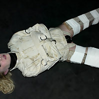 Sarah Jane Ceylon in medical straitjacket and latex bondage