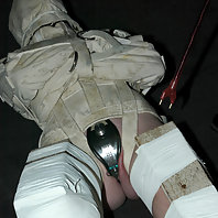 Sarah Jane Ceylon in medical straitjacket and latex bondage