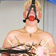 Suspension bondage with tit torture.